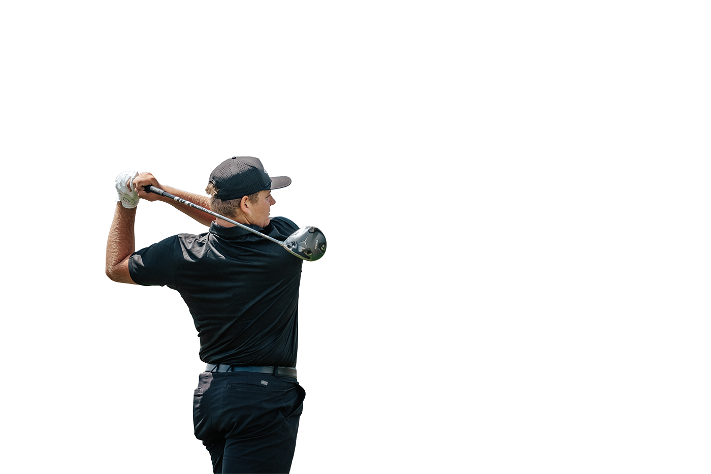 A golfer on the course using golf equipment from a Tee Box club fitting.